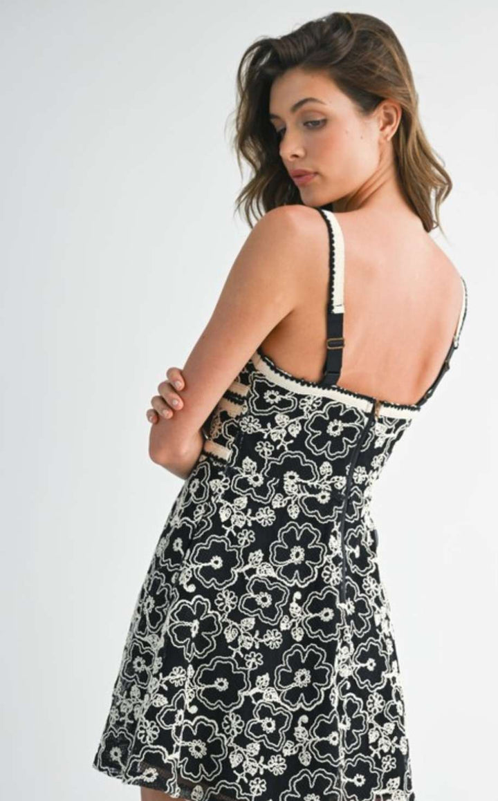 Women's black embroidered mini dress with short sleeves and detailed stitching – elegant boho-inspired short dress for casual or semi-formal occasions