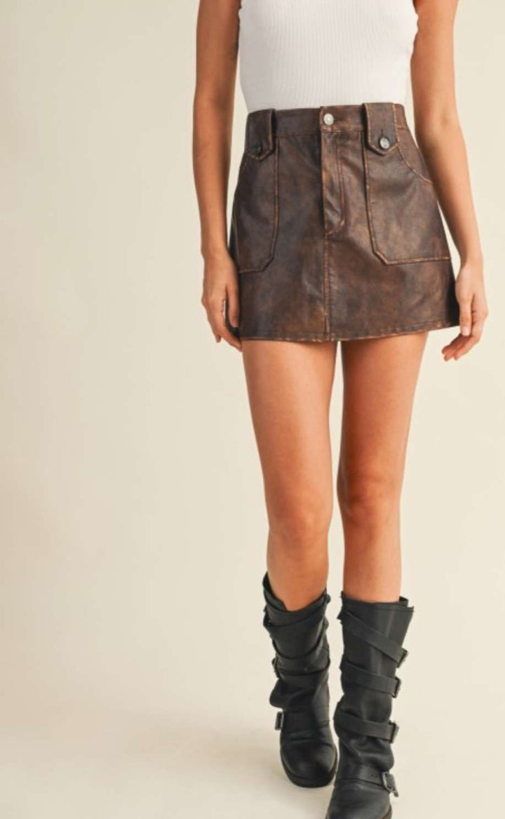 Trendy brown pleather mini skirt for women – faux leather design, perfect for night outs, fall fashion, and edgy street style looks.