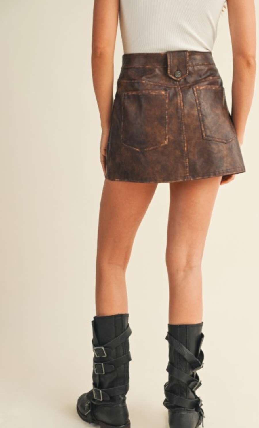 Trendy brown pleather mini skirt for women – faux leather design, perfect for night outs, fall fashion, and edgy street style looks.