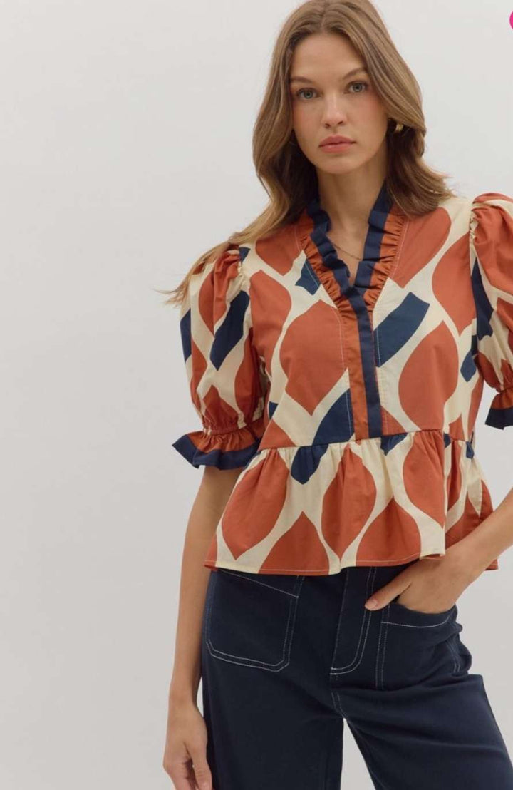 Women's rust abstract print peplum top with sleeveless design and flared waist – stylish casual blouse for fall or summer outfits