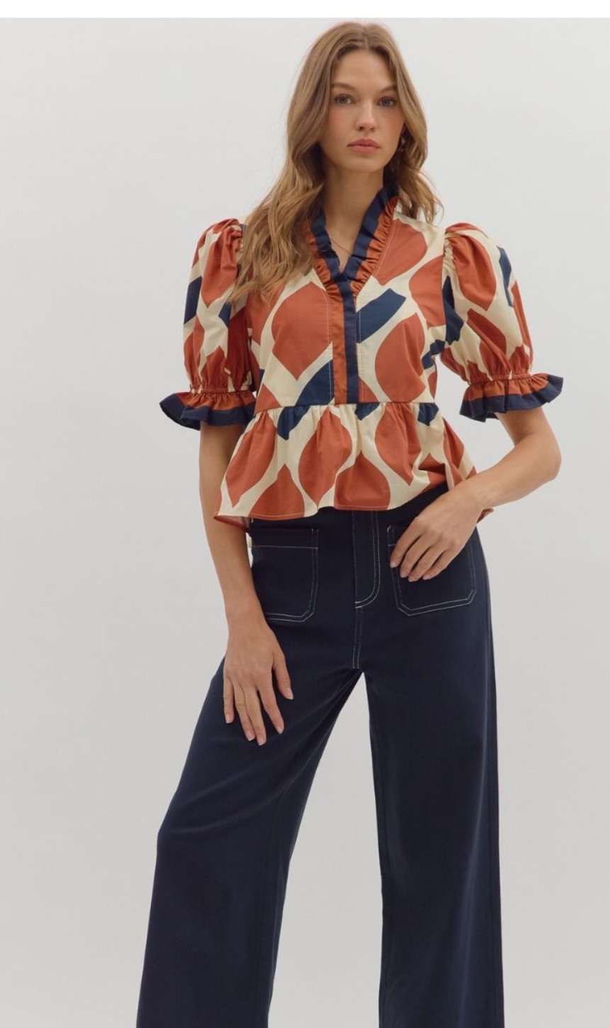 Women's rust abstract print peplum top with sleeveless design and flared waist – stylish casual blouse for fall or summer outfits