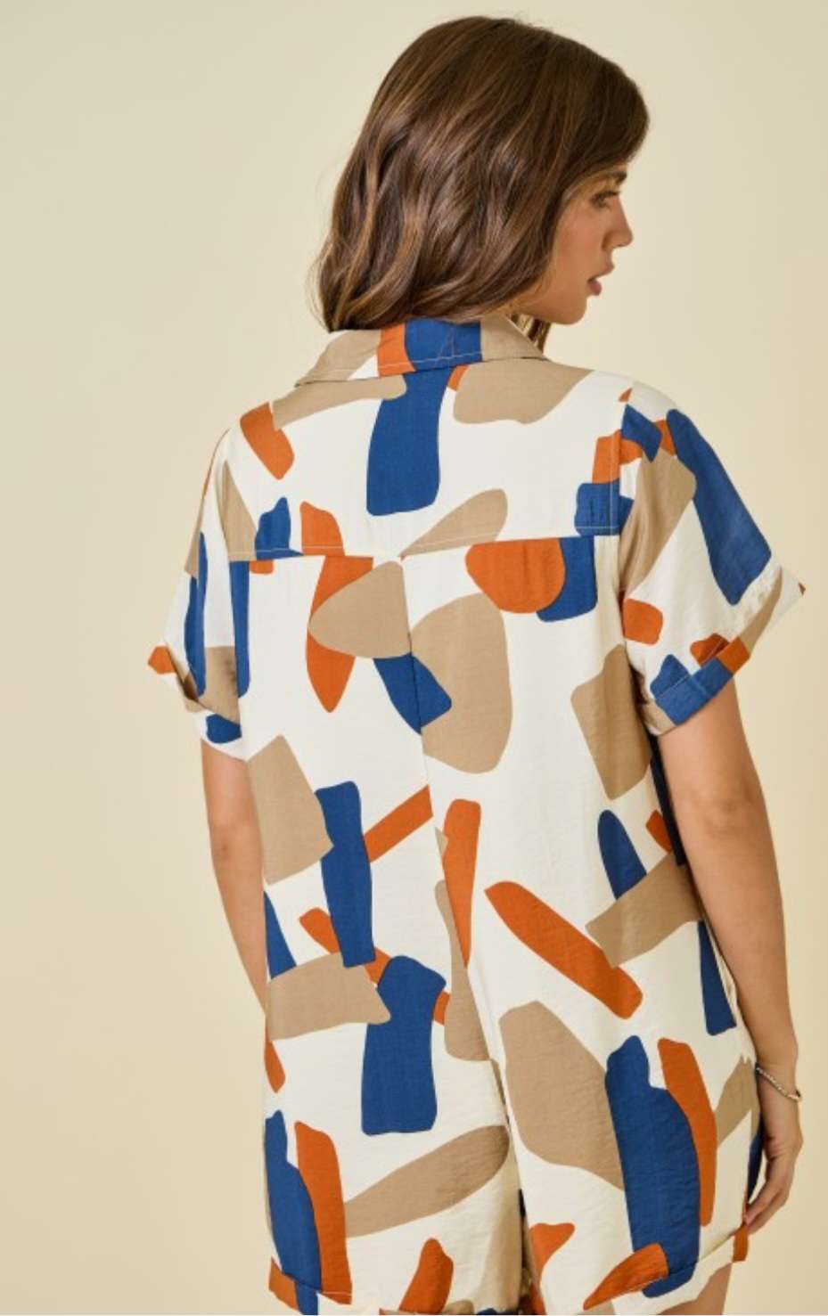 Boho-style rust romper with bold geometric prints – fashion inspiration