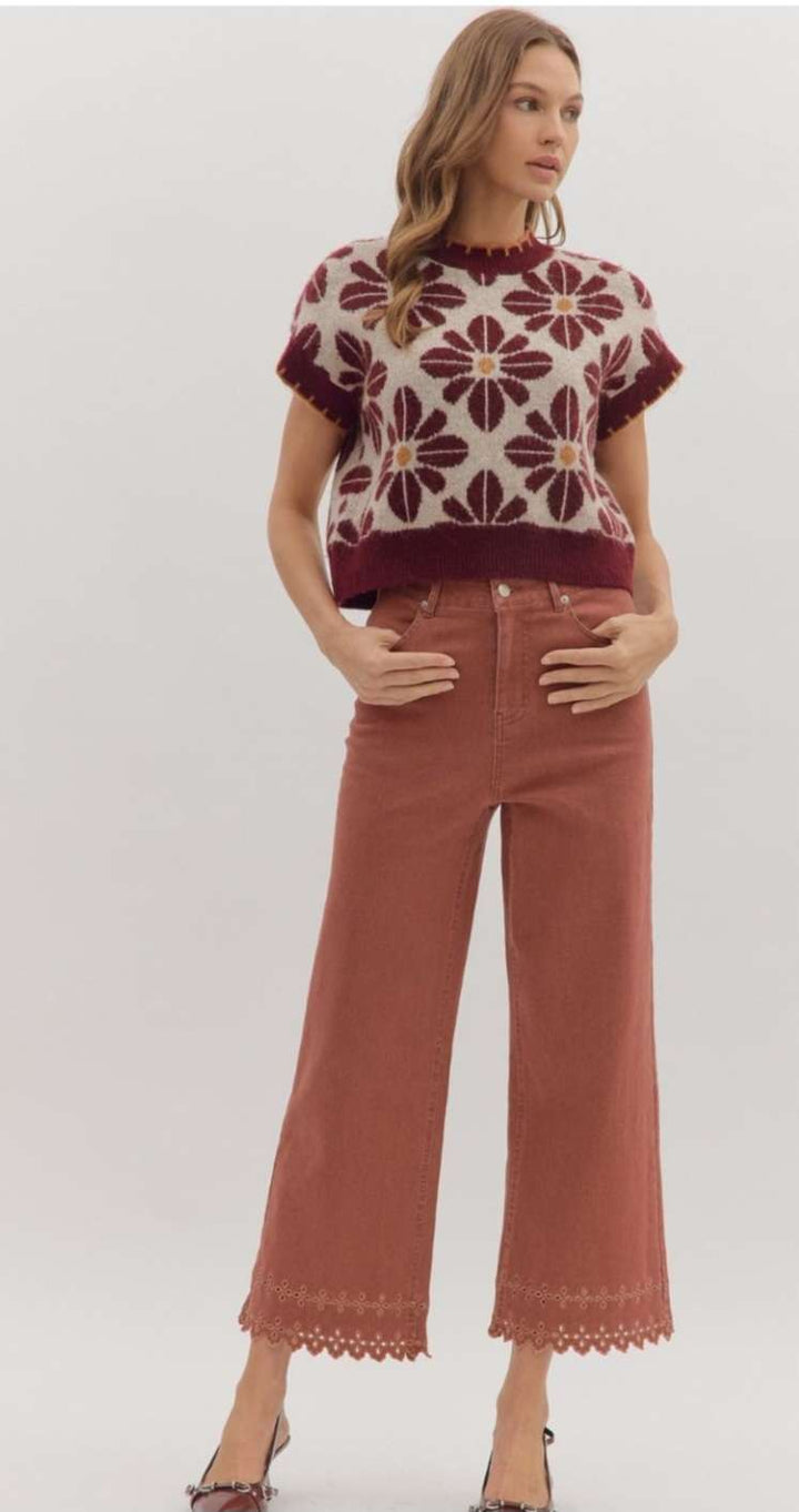 High-waisted brick denim pants featuring decorative eyelet hem