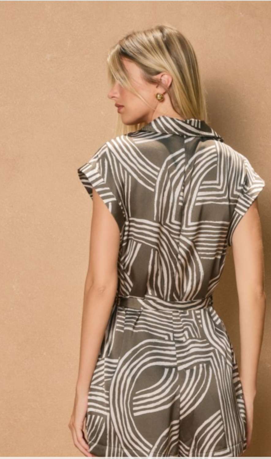 Stylish olive green romper with printed design and button-down front