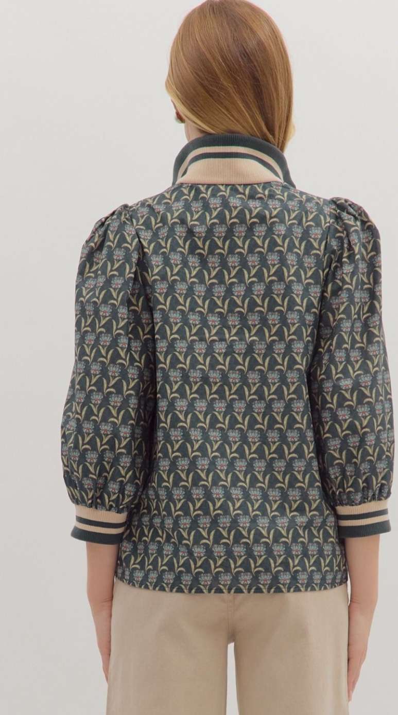 Blue patterned zipper top with collar and front zip closure – perfect blend of comfort and style.