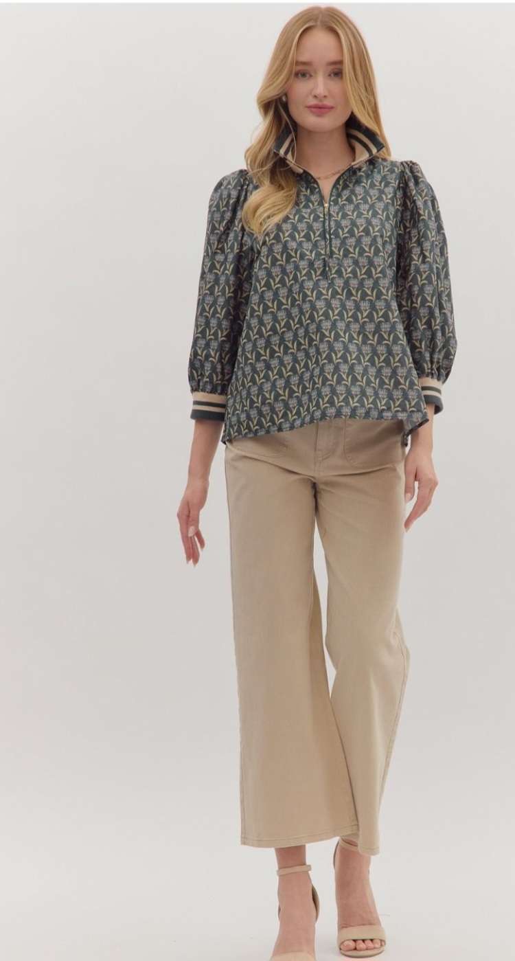 Blue patterned zipper top with collar and front zip closure – perfect blend of comfort and style.