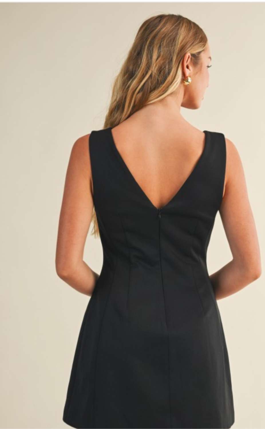 Black mini dress with deep V-neckline