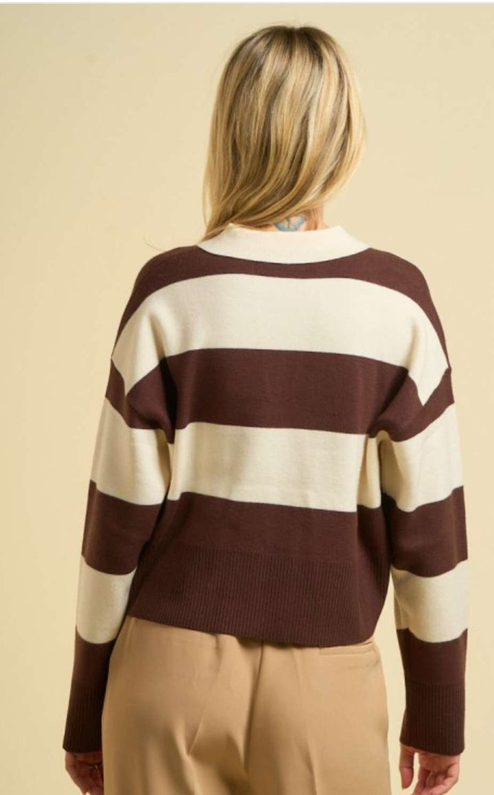Women’s brown stripe sweater polo with classic collar, long sleeves, and ribbed cuffs, styled for a chic smart-casual look.