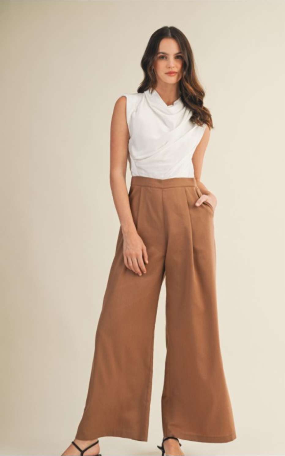 Elegant two-tone cowl neck jumpsuit in camel and cream colorblock design