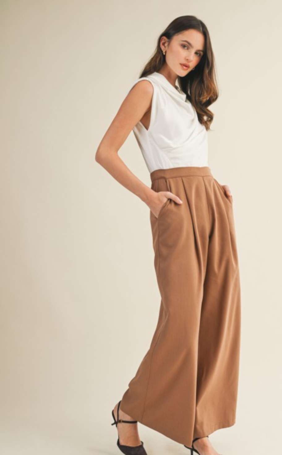 Elegant two-tone cowl neck jumpsuit in camel and cream colorblock design