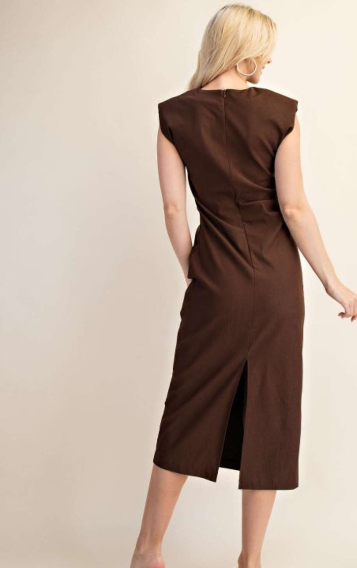 Model wearing brown round neck midi dress styled with ankle boots – casual yet chic outfit for autumn or spring
