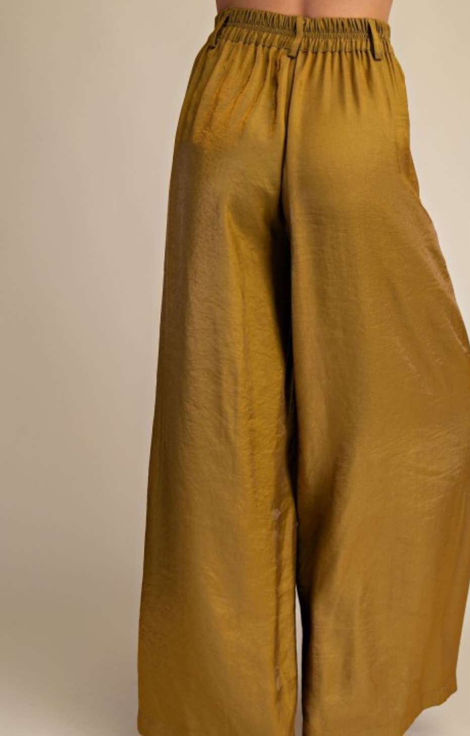 Mustard wide-leg high-rise pants with structured waistband and flowing silhouette – stylish wardrobe staple for modern women