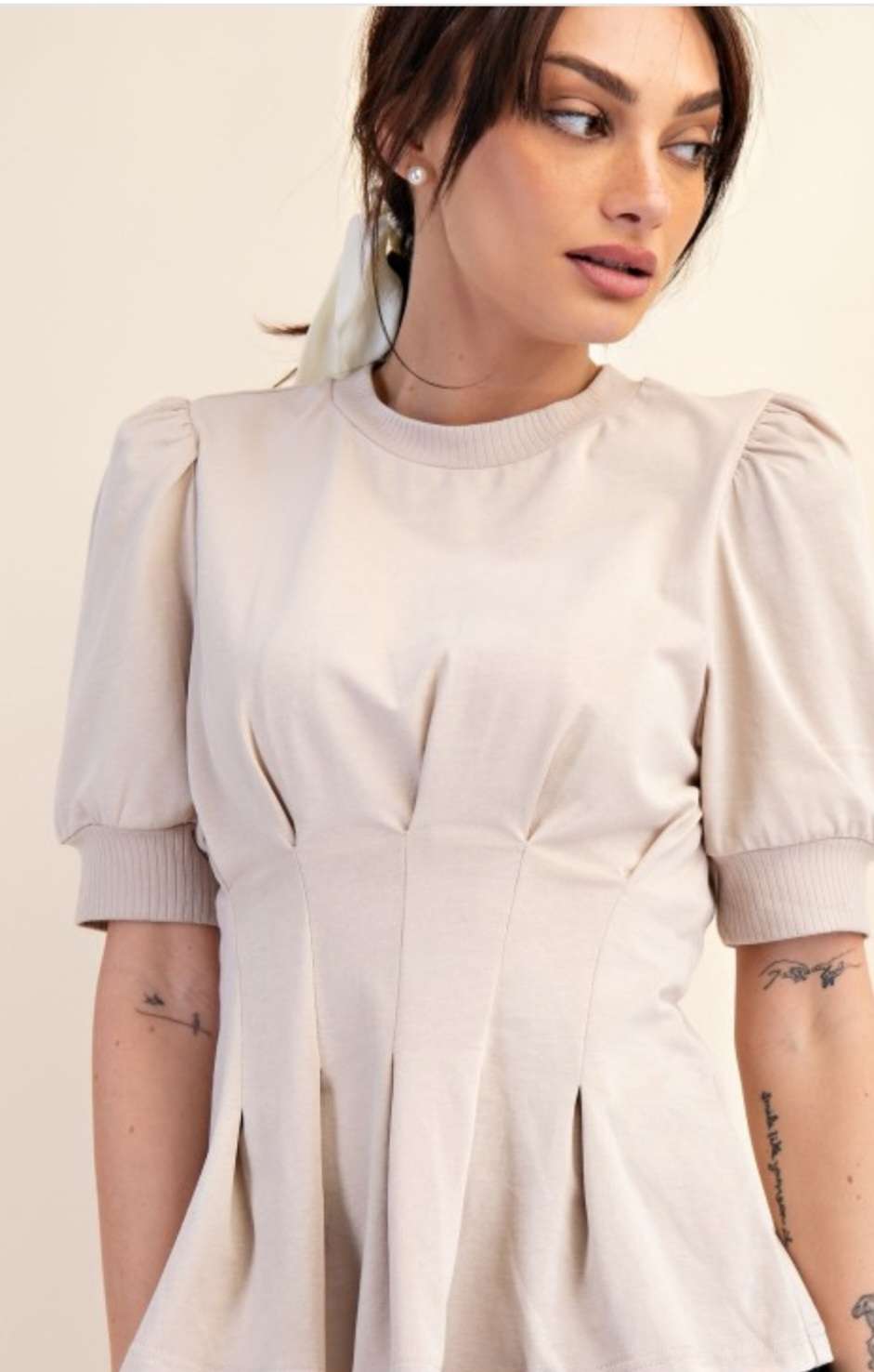 Women's beige peplum top with puff sleeves – stylish and flattering blouse for casual and dressy occasions