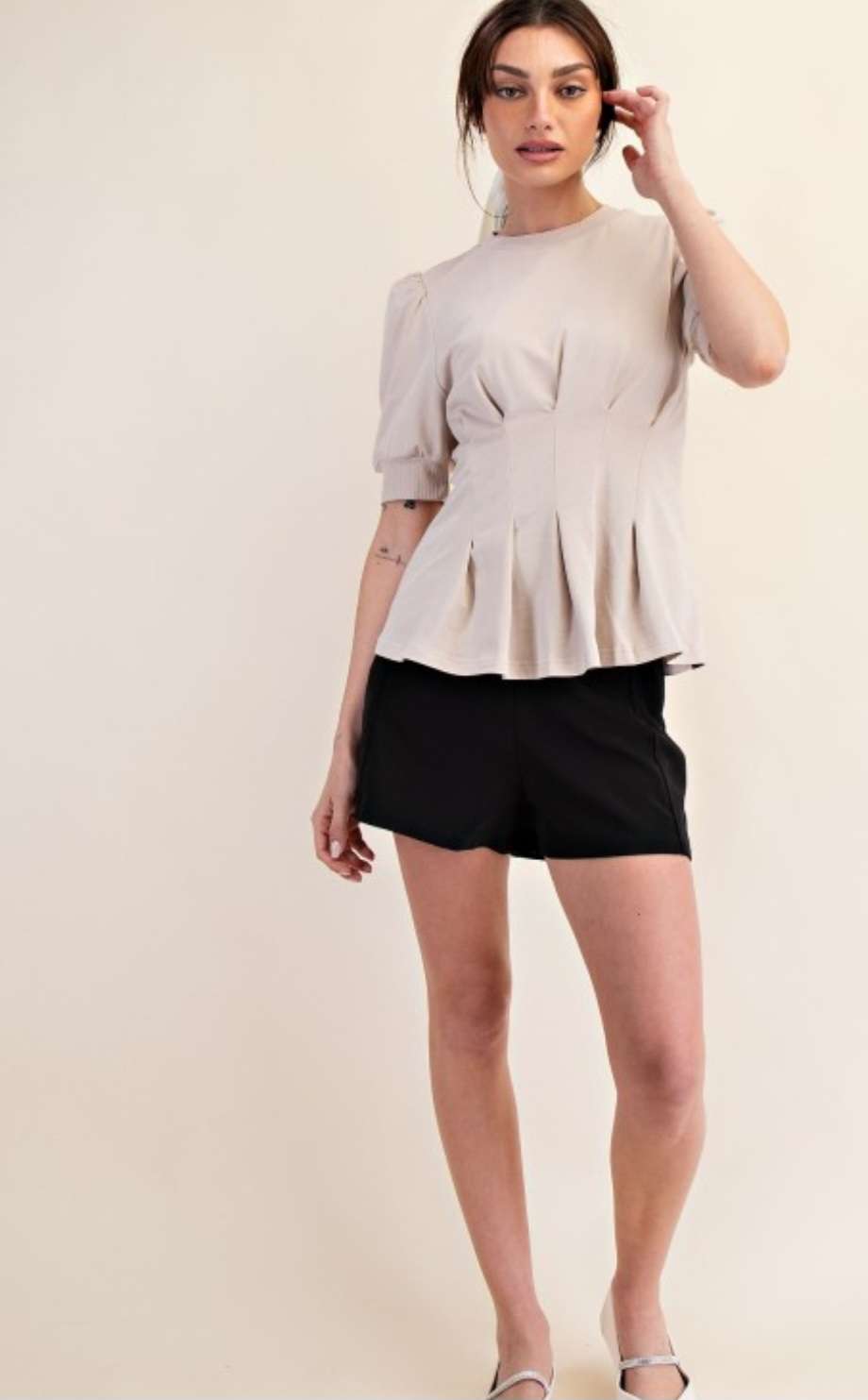 Women's beige peplum top with puff sleeves – stylish and flattering blouse for casual and dressy occasions