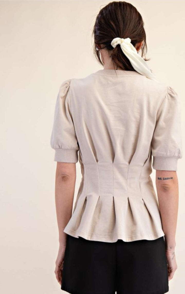 Women's beige peplum top with puff sleeves – stylish and flattering blouse for casual and dressy occasions