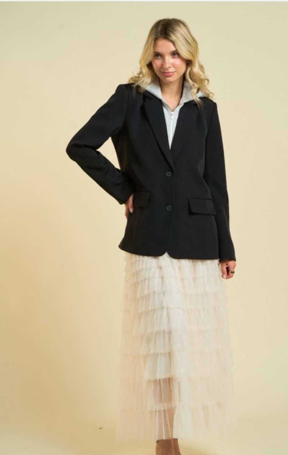 Black and grey hoodie blazer with a casual yet sophisticated design, featuring a comfortable hood and tailored blazer fit, perfect for smart-casual and streetwear styles.