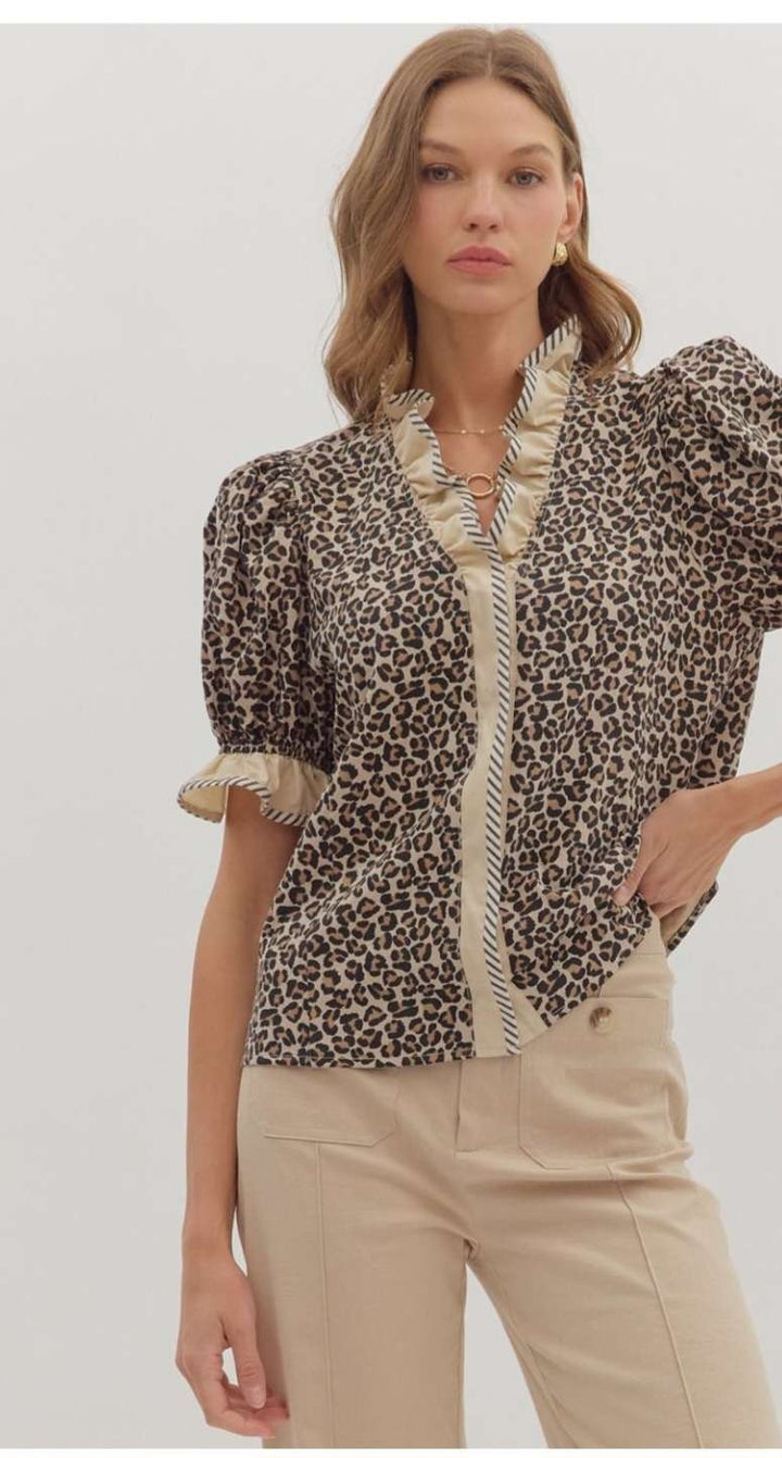 Women's leopard print puff sleeve top for a bold, stylish look