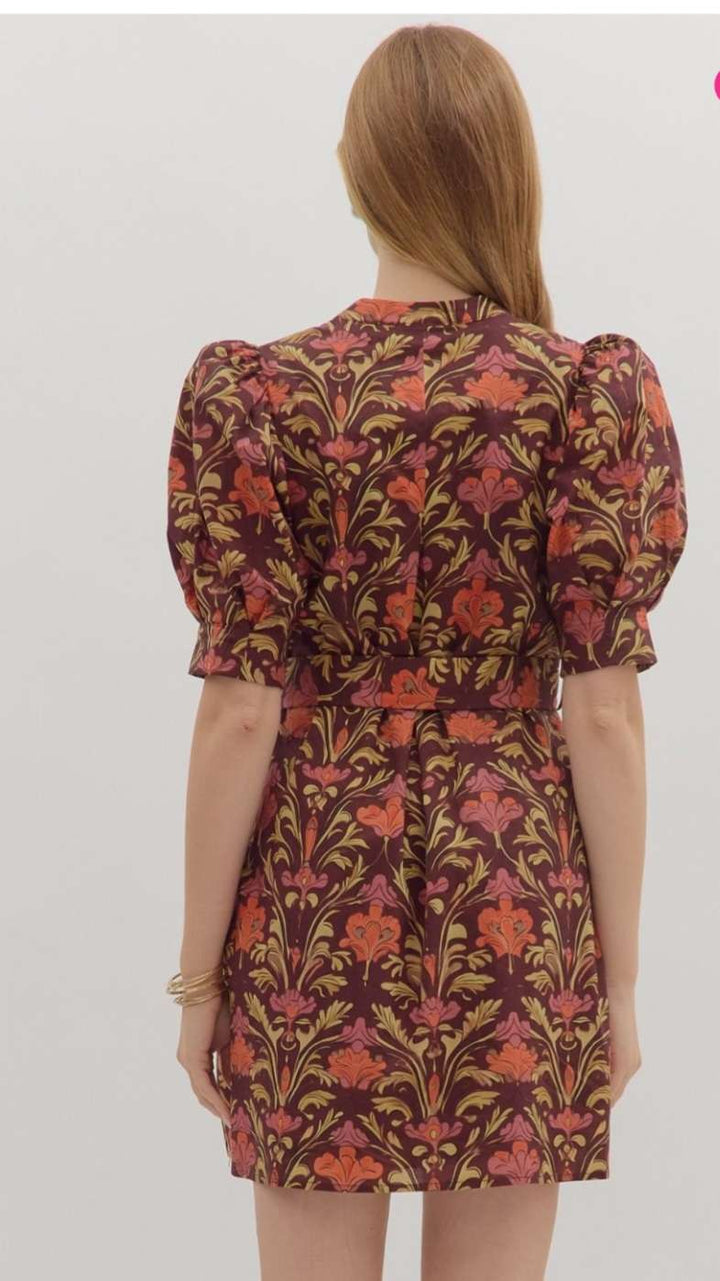 Burgundy floral print belted dress with a flattering waist tie and flowy silhouette, perfect for casual or semi-formal occasions.
