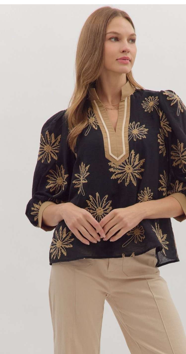 Black embroidered 3/4 sleeve women’s top with intricate floral detailing.