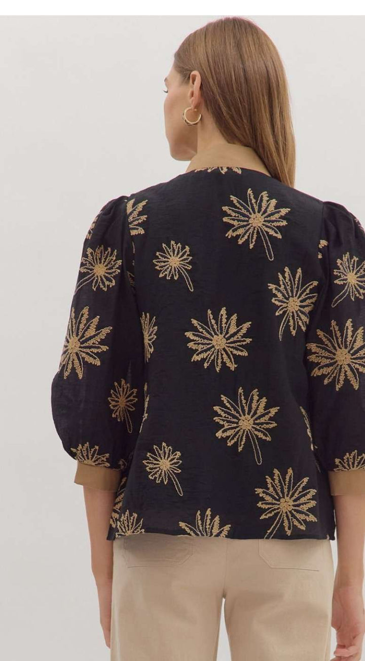 Black embroidered 3/4 sleeve women’s top with intricate floral detailing.
