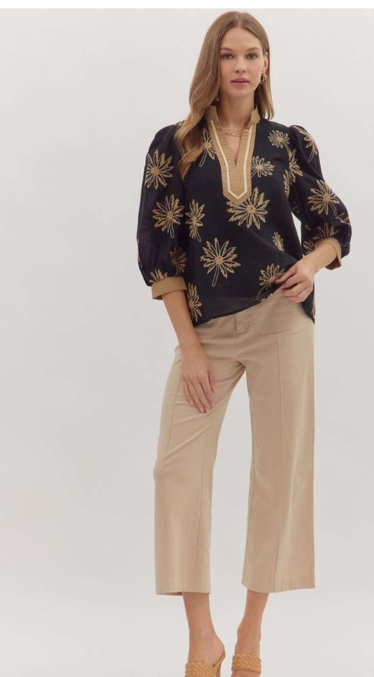 Black embroidered 3/4 sleeve women’s top with intricate floral detailing.