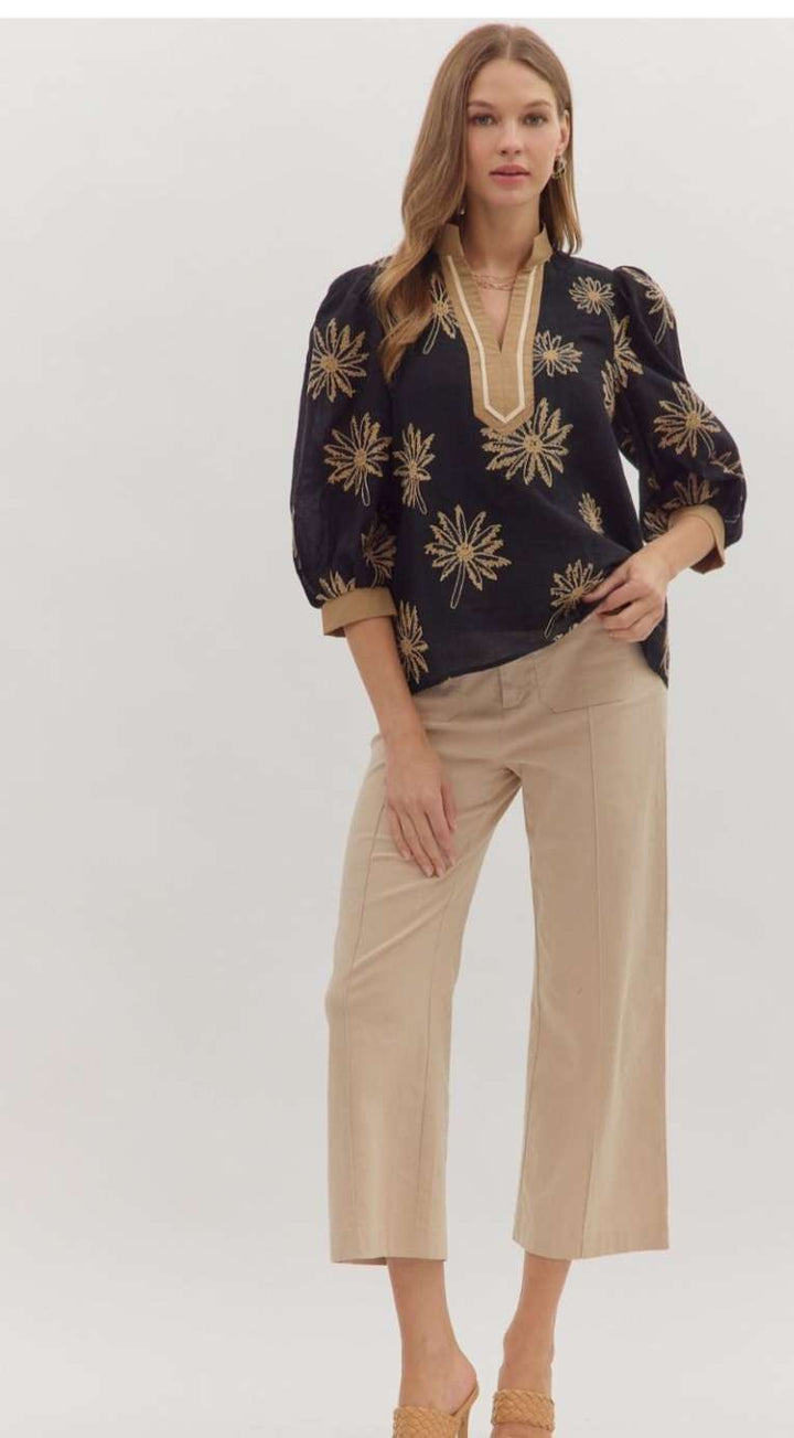 Black embroidered 3/4 sleeve women’s top with intricate floral detailing.