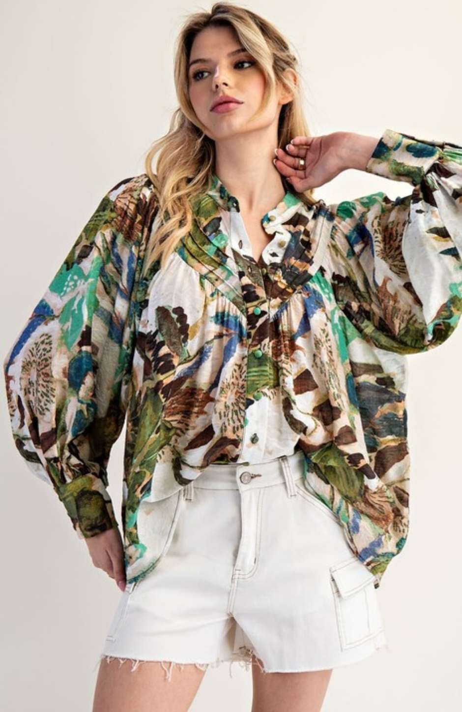 Women’s abstract floral button-down blouse with long sleeves and lightweight fabric.