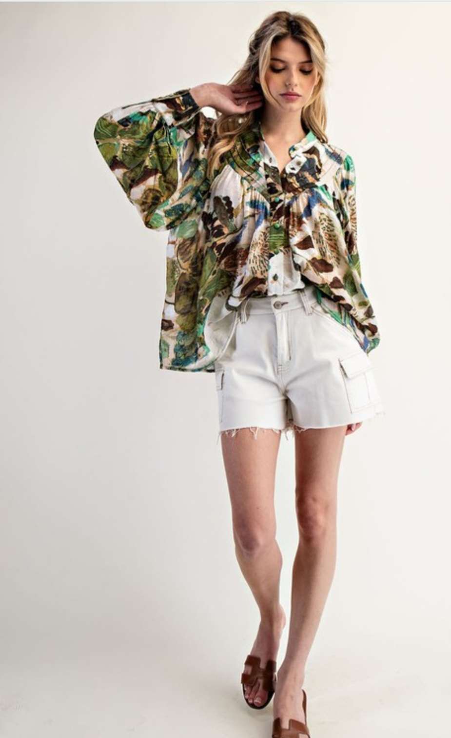 Women’s abstract floral button-down blouse with long sleeves and lightweight fabric.