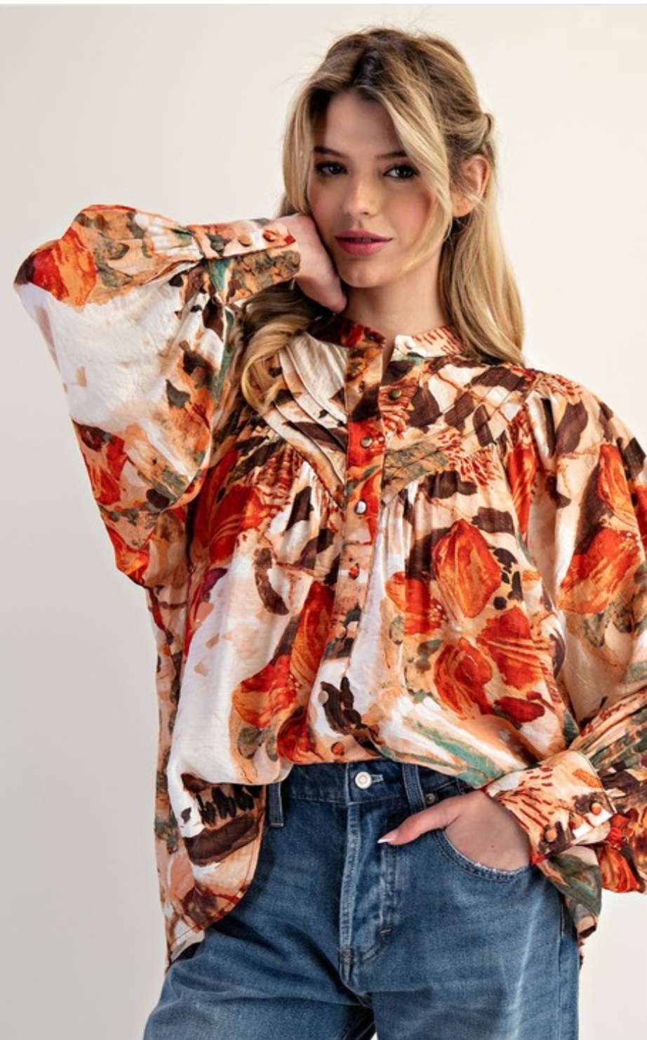 Women’s abstract floral button-down blouse with long sleeves and lightweight fabric.