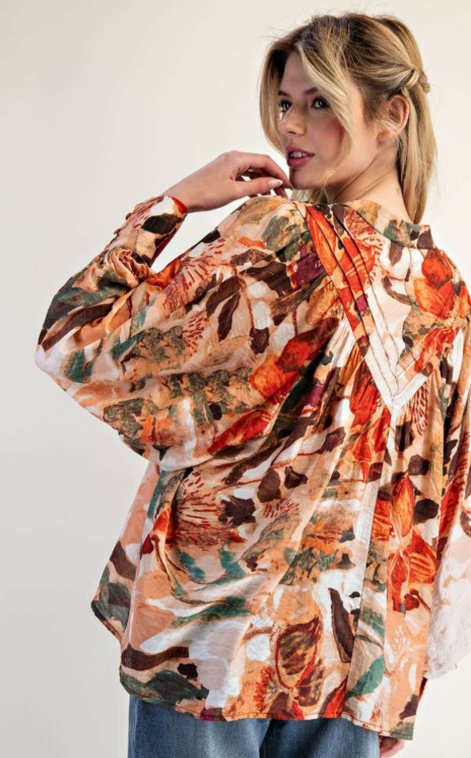 Women’s abstract floral button-down blouse with long sleeves and lightweight fabric.