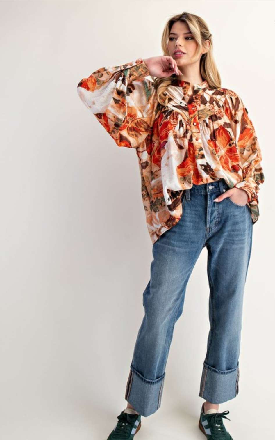 Women’s abstract floral button-down blouse with long sleeves and lightweight fabric.