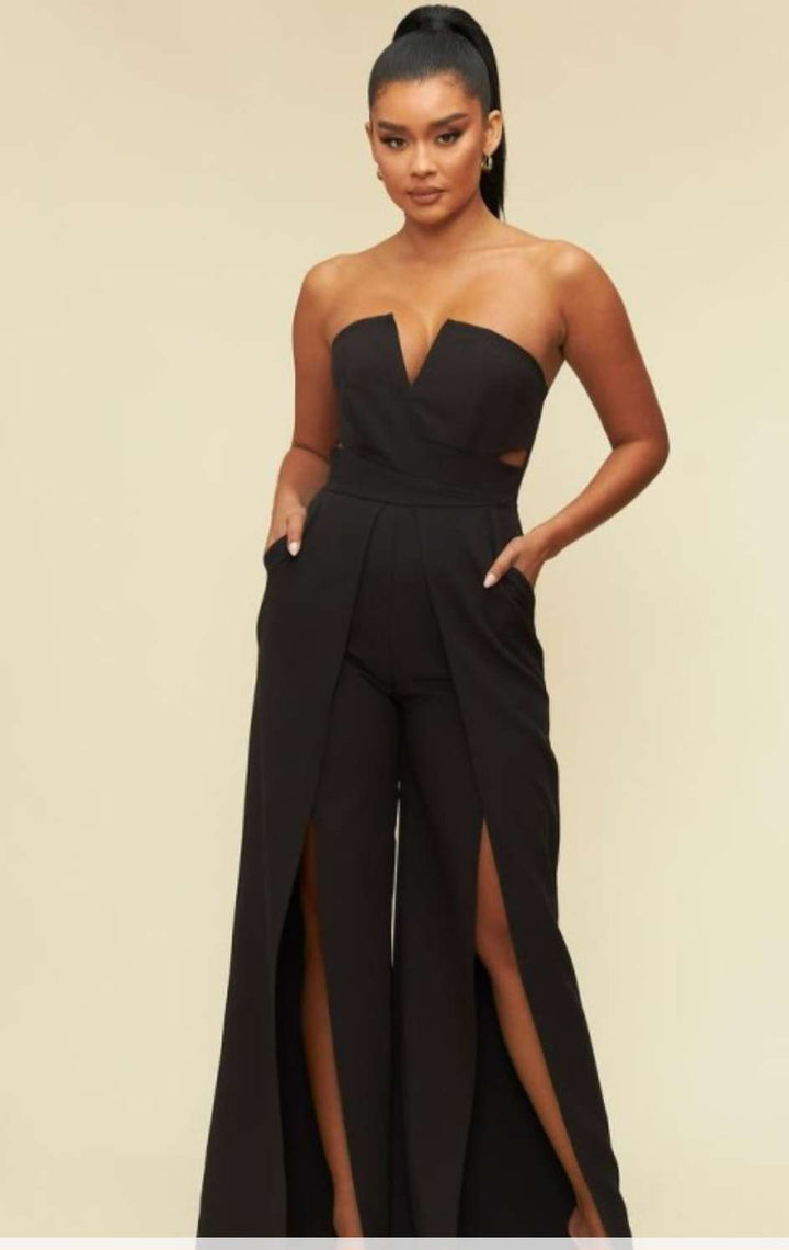 Elegant black strapless jumpsuit featuring thigh-high slit and tailored fit