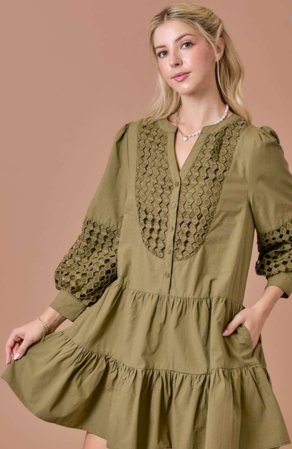 Olive eyelet tiered short dress with 3/4 sleeves, featuring delicate eyelet embroidery, flowy tiered skirt, and a flattering relaxed fit.