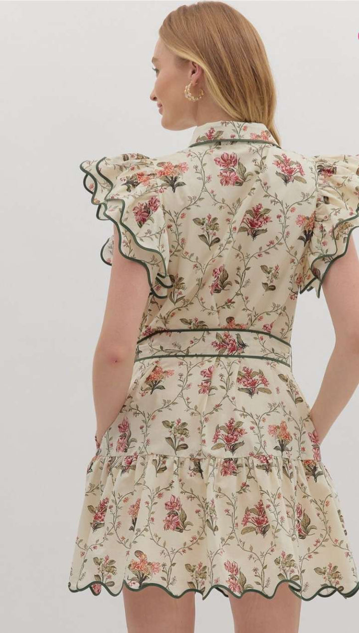 Ecru floral dress with green trim, featuring delicate floral print and elegant lightweight fabric