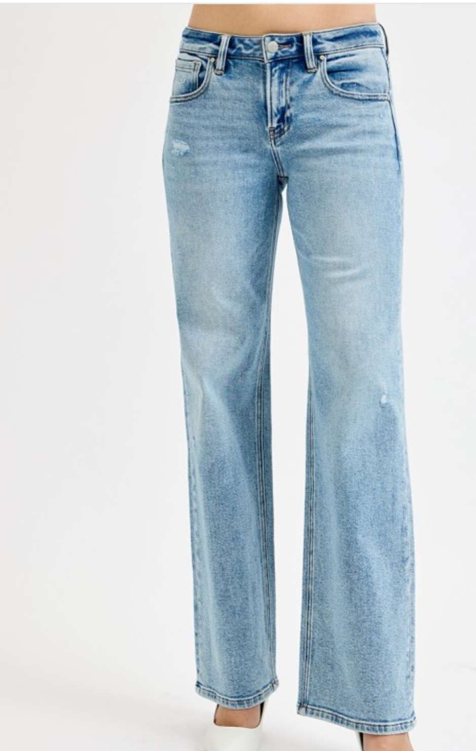 Low rise wide leg jeans for women in light blue denim, featuring relaxed fit and casual street style look.