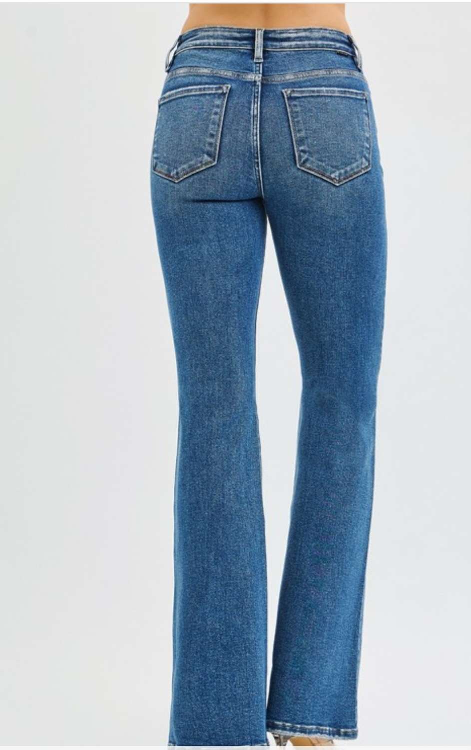 High-rise flare jeans in medium wash denim with classic five-pocket design and flattering fit.