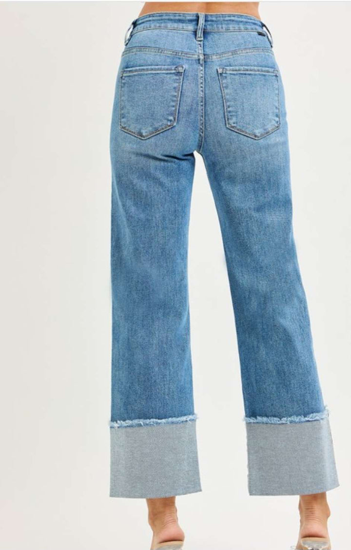 Mid rise crop wide cuff jeans for women in light blue denim, featuring relaxed fit and trendy cropped wide leg design.