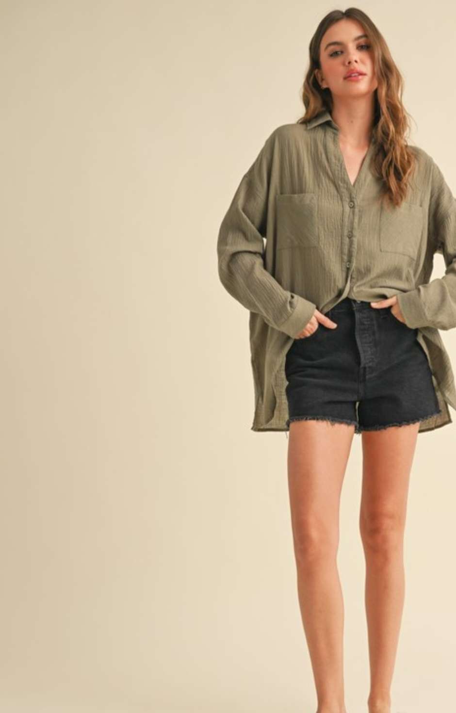 Olive green button-up top with classic collar and versatile long sleeves for everyday wear.
