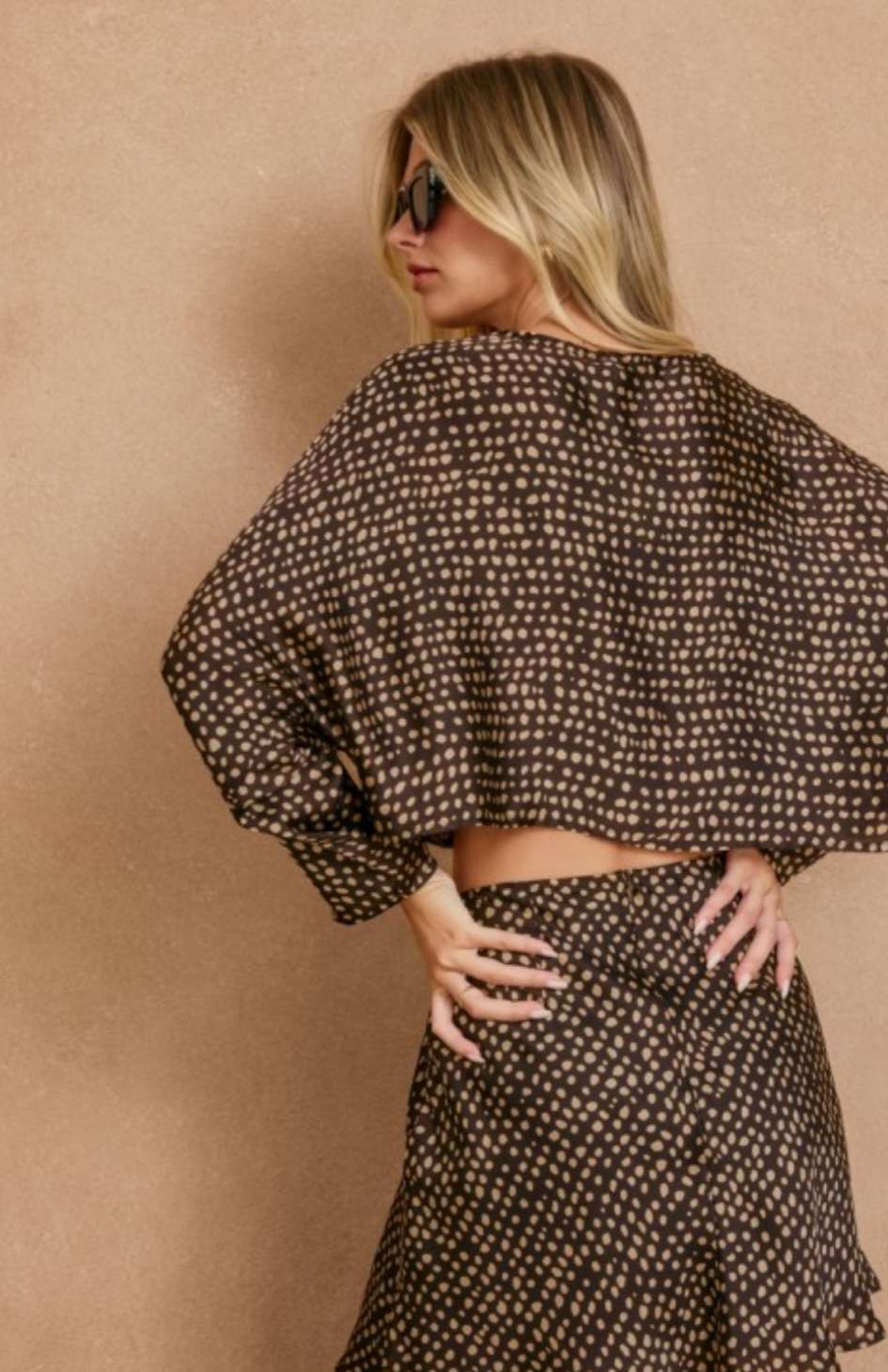 Women’s brown printed boat neck top with relaxed fit and stylish pattern