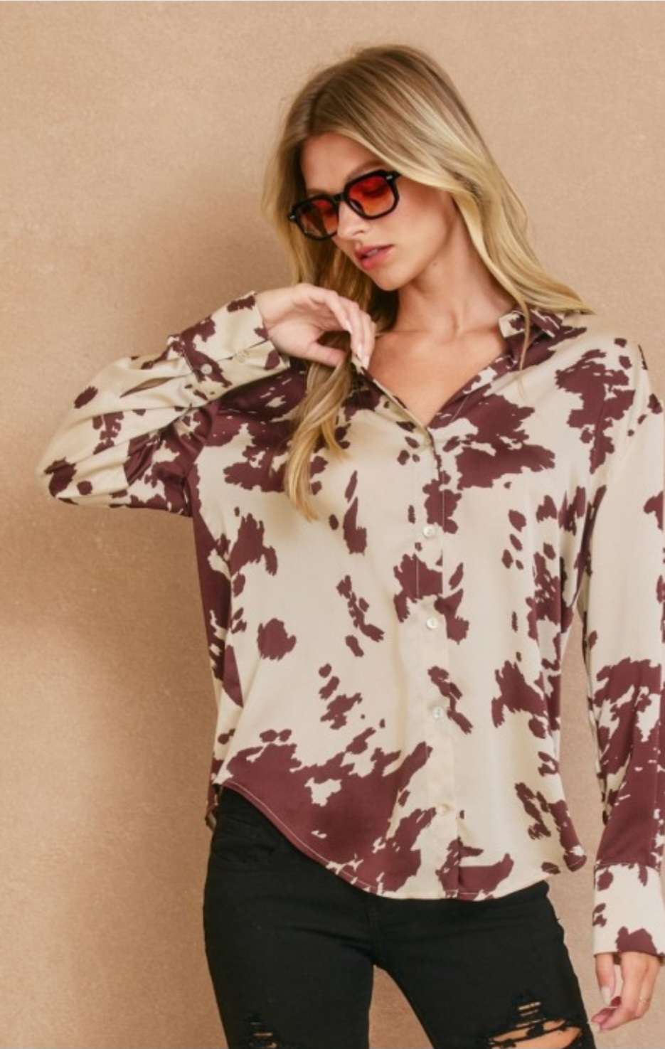 Women’s cream and brown print button top with stylish front buttons and relaxed fit.