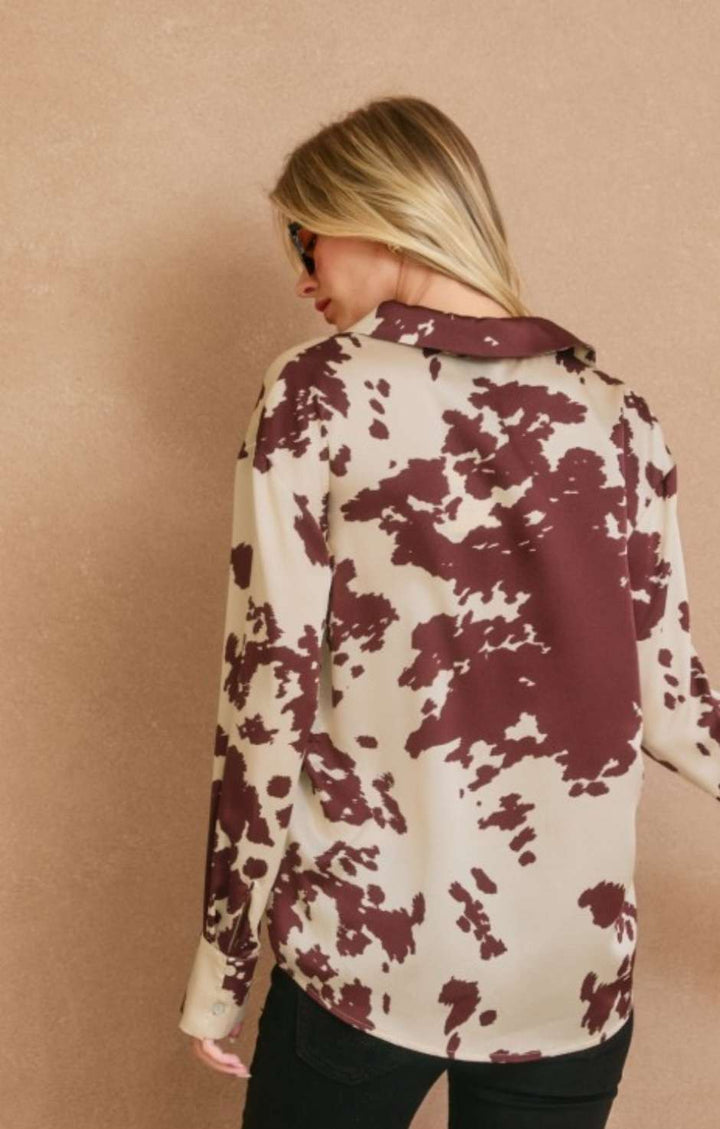Women’s cream and brown print button top with stylish front buttons and relaxed fit.