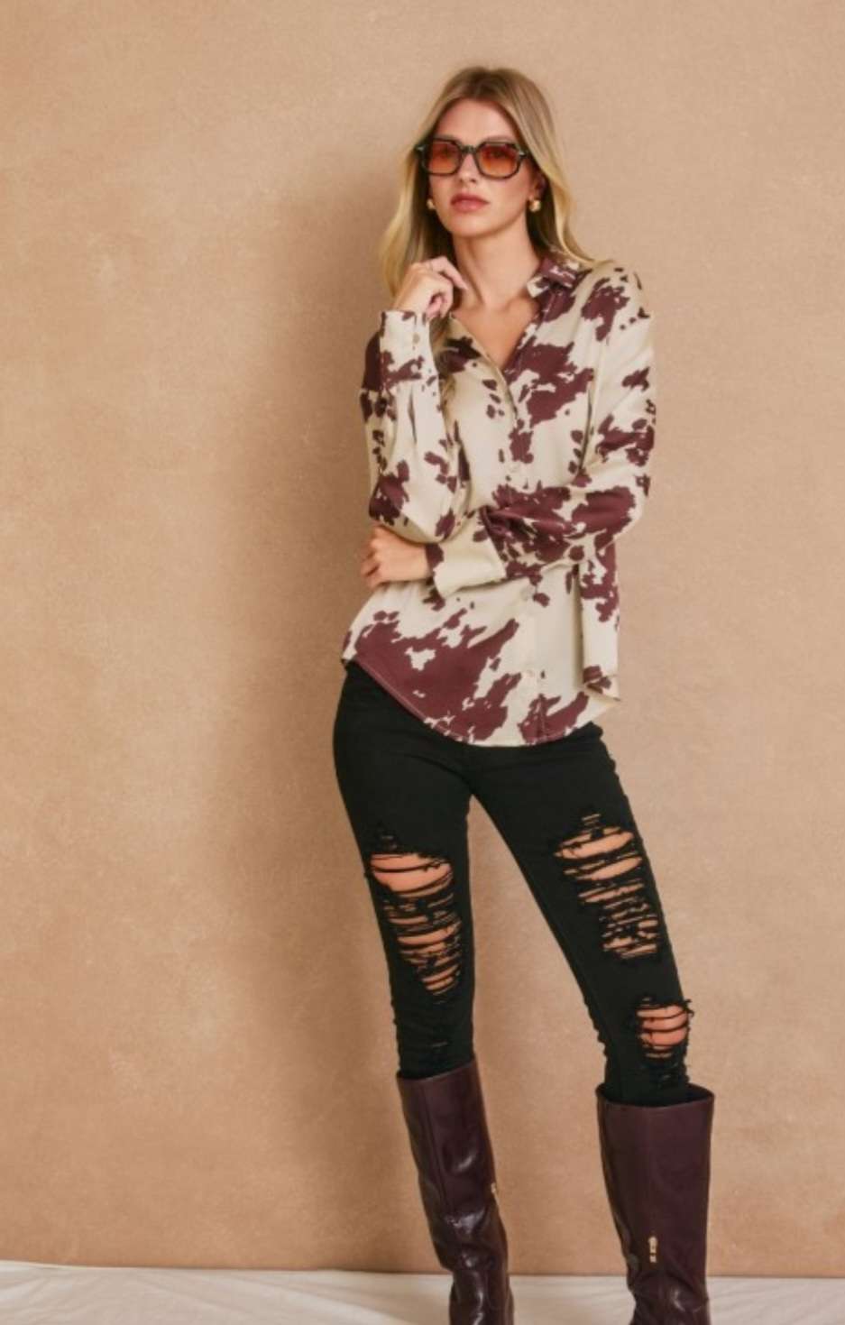 Women’s cream and brown print button top with stylish front buttons and relaxed fit.