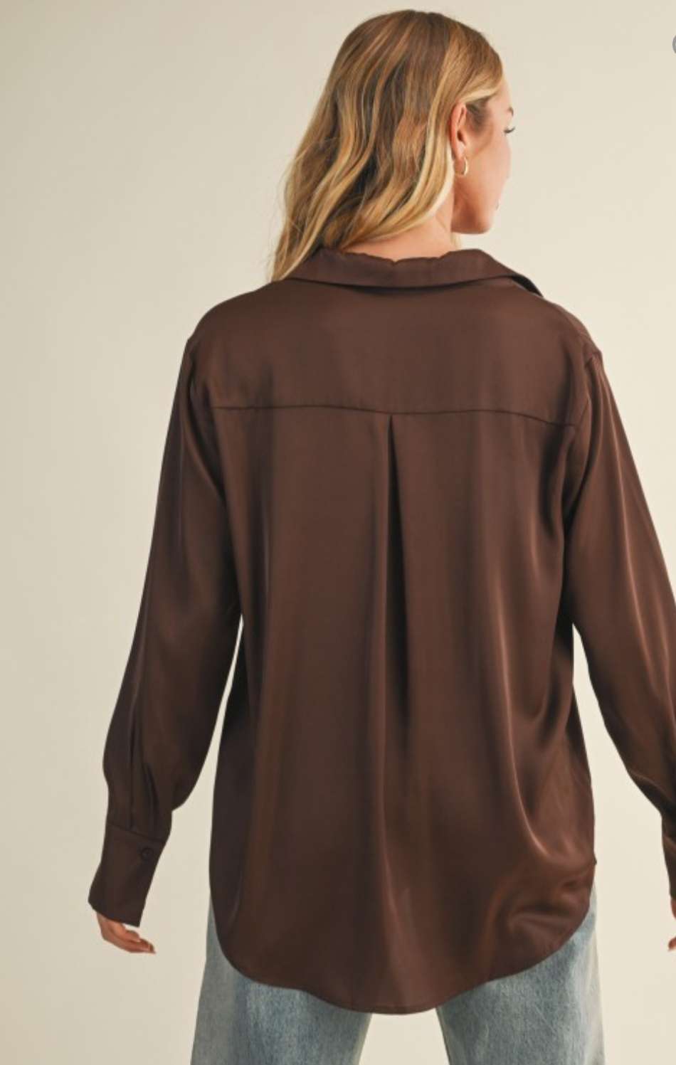 Women's brown silky button-up top with soft satin finish and elegant collar.