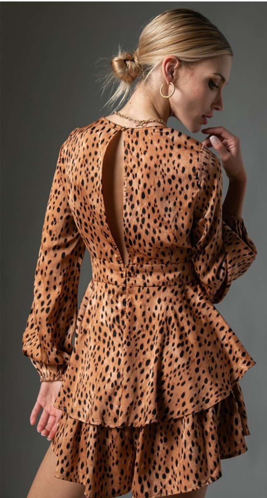 Trendy leopard print ruffle romper designed for casual outings, featuring soft fabric and flattering ruffle trim