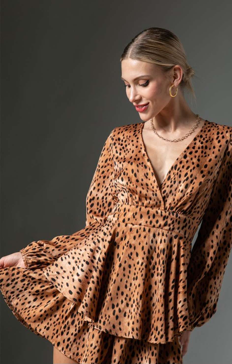 Trendy leopard print ruffle romper designed for casual outings, featuring soft fabric and flattering ruffle trim