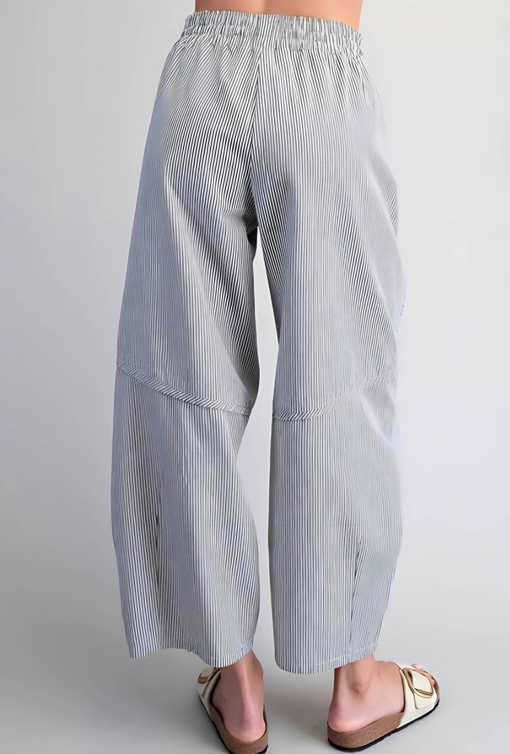 Light blue and white striped pants on a plain background