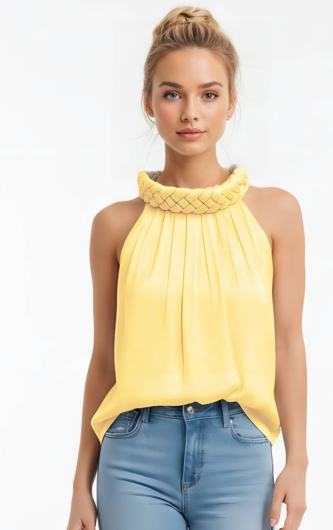 Woman wearing a yellow sleeveless top with a braided neckline on a white background