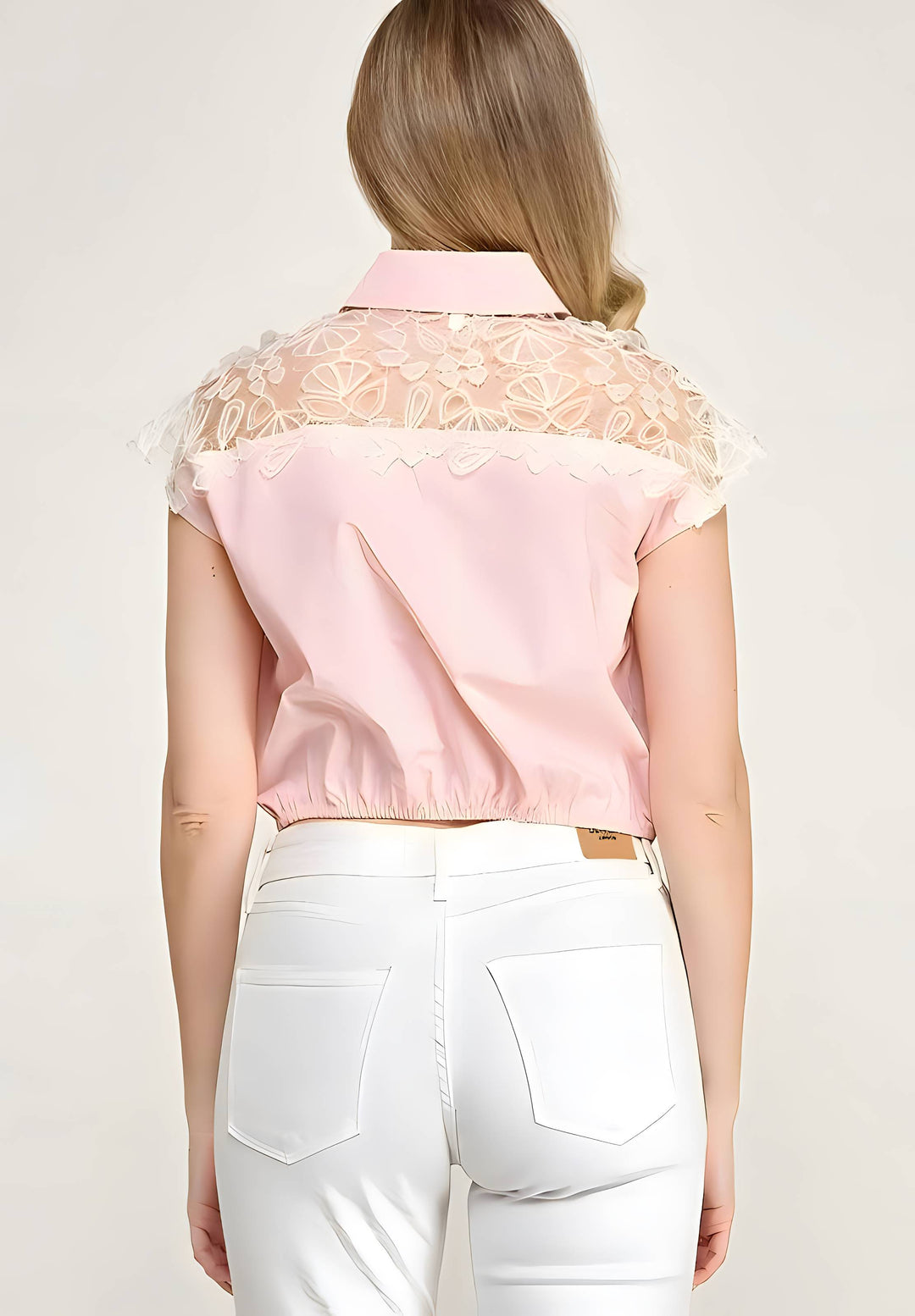  Blouse with lace details worn by a person on a plain background