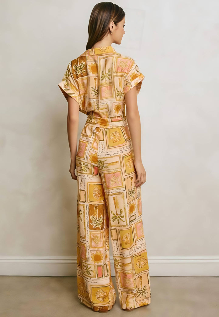 Woman wearing a patterned outfit against a plain background